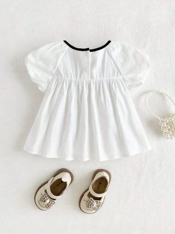Cozy Cub Girls' Casual Cute White Princess Style Bow Soft & Comfy Contrast Color Short Sleeve Round Neck Blouse For Christening, Birthday Party, School, Casual Occasions Cozy Cub Girls' Casual Cute White Princess Style Bow Soft & Comfy Contrast Color Short Sleeve Round Neck Blouse For Christening, Birthday Party, School, Casual Occasions