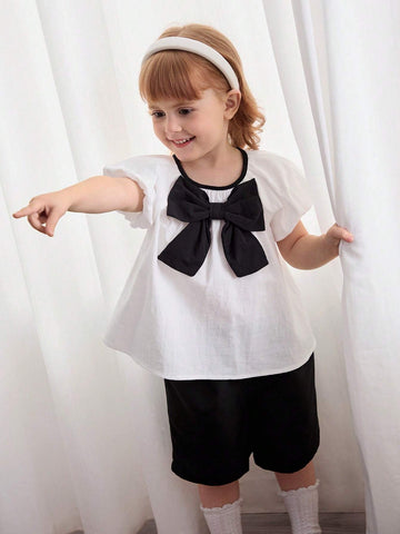 Cozy Cub Girls' Casual Cute White Princess Style Bow Soft & Comfy Contrast Color Short Sleeve Round Neck Blouse For Christening, Birthday Party, School, Casual Occasions Cozy Cub Girls' Casual Cute White Princess Style Bow Soft & Comfy Contrast Color Short Sleeve Round Neck Blouse For Christening, Birthday Party, School, Casual Occasions