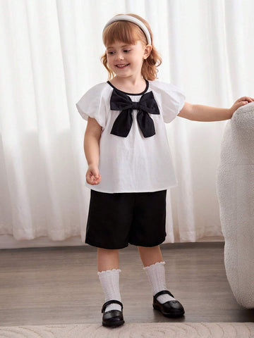 Cozy Cub Girls' Casual Cute White Princess Style Bow Soft & Comfy Contrast Color Short Sleeve Round Neck Blouse For Christening, Birthday Party, School, Casual Occasions Cozy Cub Girls' Casual Cute White Princess Style Bow Soft & Comfy Contrast Color Short Sleeve Round Neck Blouse For Christening, Birthday Party, School, Casual Occasions