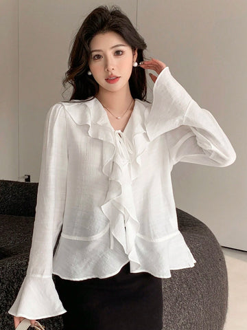 DAZY Women's Solid Color Relaxed Fit Bell Sleeve Shirt With Ruffle Hem And Tie Waist DAZY Women's Solid Color Relaxed Fit Bell Sleeve Shirt With Ruffle Hem And Tie Waist
