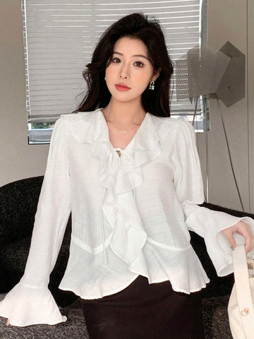 DAZY Women's Solid Color Relaxed Fit Bell Sleeve Shirt With Ruffle Hem And Tie Waist DAZY Women's Solid Color Relaxed Fit Bell Sleeve Shirt With Ruffle Hem And Tie Waist