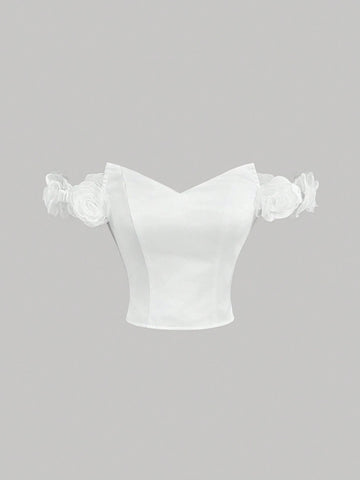 White Off-Shoulder Top With Asymmetric Neckline, 3D Floral Decoration And Bustier Design For White Off-Shoulder Top With Asymmetric Neckline, 3D Floral Decoration And Bustier Design For