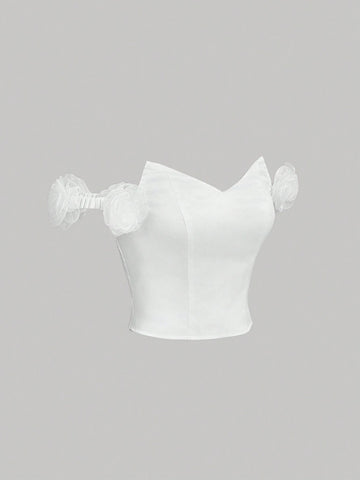 White Off-Shoulder Top With Asymmetric Neckline, 3D Floral Decoration And Bustier Design For White Off-Shoulder Top With Asymmetric Neckline, 3D Floral Decoration And Bustier Design For