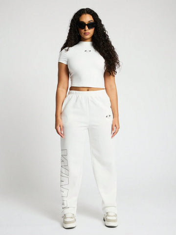 SUMWON WOMEN High Neck Crop Top And Straight Leg Jogger Co Ord With Graphic Print SUMWON WOMEN High Neck Crop Top And Straight Leg Jogger Co Ord With Graphic Print