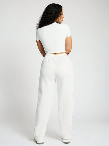 SUMWON WOMEN High Neck Crop Top And Straight Leg Jogger Co Ord With Graphic Print SUMWON WOMEN High Neck Crop Top And Straight Leg Jogger Co Ord With Graphic Print