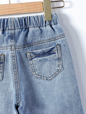 Young Girl Street Style Cool Light Blue Washed, Ripped, Cut-Out, Drawstring, Elastic Waistband, Wide Leg Jeans. Young Girl Street Style Cool Light Blue Washed, Ripped, Cut-Out, Drawstring, Elastic Waistband, Wide Leg Jeans.