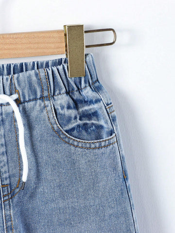Young Girl Street Style Cool Light Blue Washed, Ripped, Cut-Out, Drawstring, Elastic Waistband, Wide Leg Jeans. Young Girl Street Style Cool Light Blue Washed, Ripped, Cut-Out, Drawstring, Elastic Waistband, Wide Leg Jeans.
