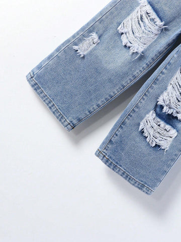 Young Girl Street Style Cool Light Blue Washed, Ripped, Cut-Out, Drawstring, Elastic Waistband, Wide Leg Jeans. Young Girl Street Style Cool Light Blue Washed, Ripped, Cut-Out, Drawstring, Elastic Waistband, Wide Leg Jeans.
