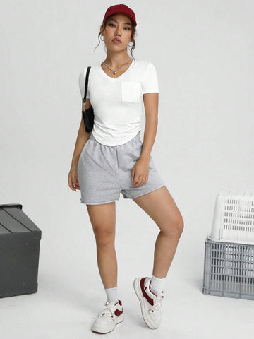 Unity Solid Pocket Patched Curved Hem Tee