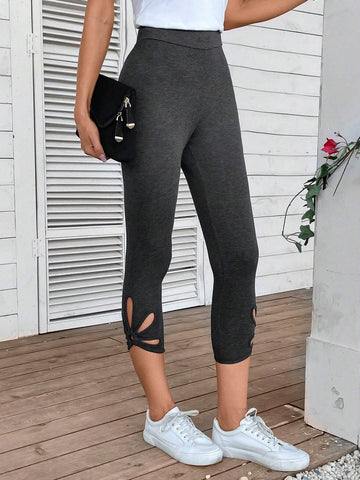 EMERY ROSE Cut Out Twist Hem Capri Leggings