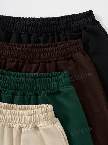 4pcs Letter Graphic Slant Pockets Shorts