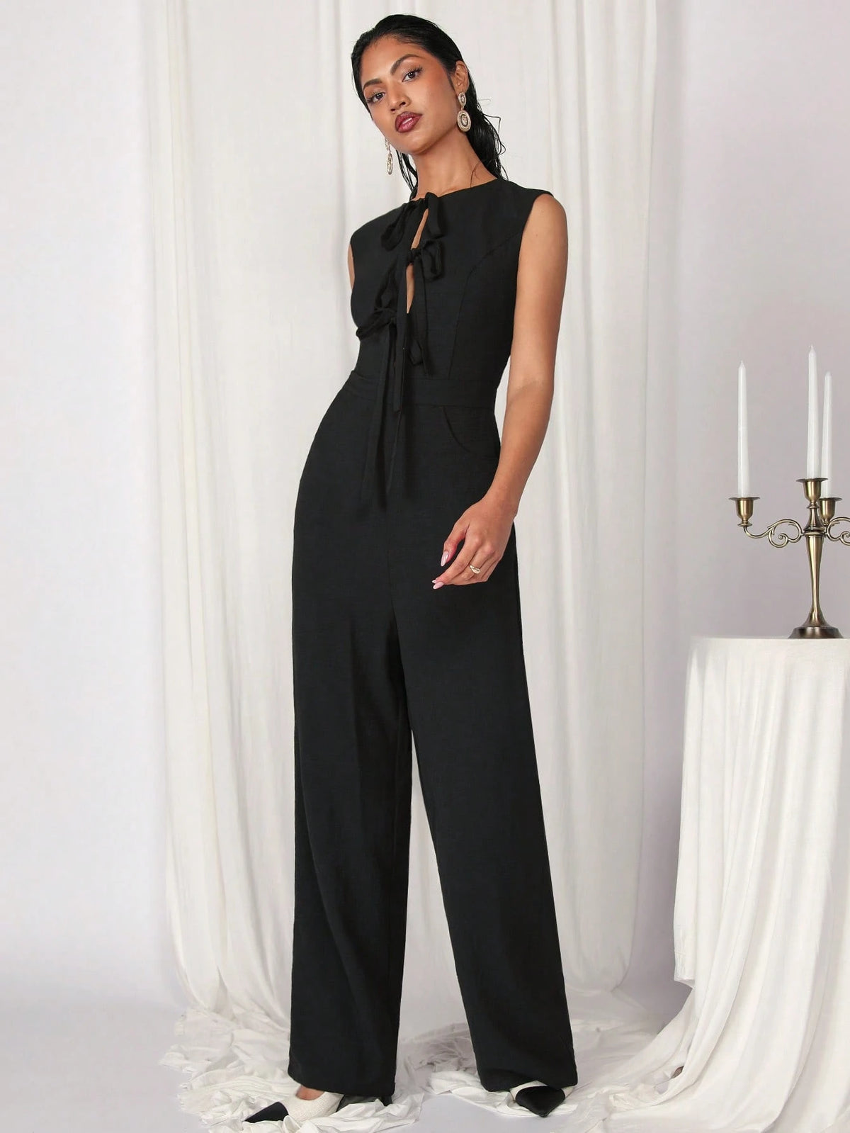 COSMINA Women's Elegant Solid Color Sleeveless Tied Black Jumpsuit For Commuting