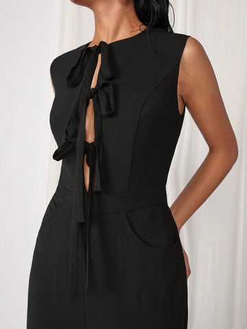 COSMINA Women's Elegant Solid Color Sleeveless Tied Black Jumpsuit For Commuting