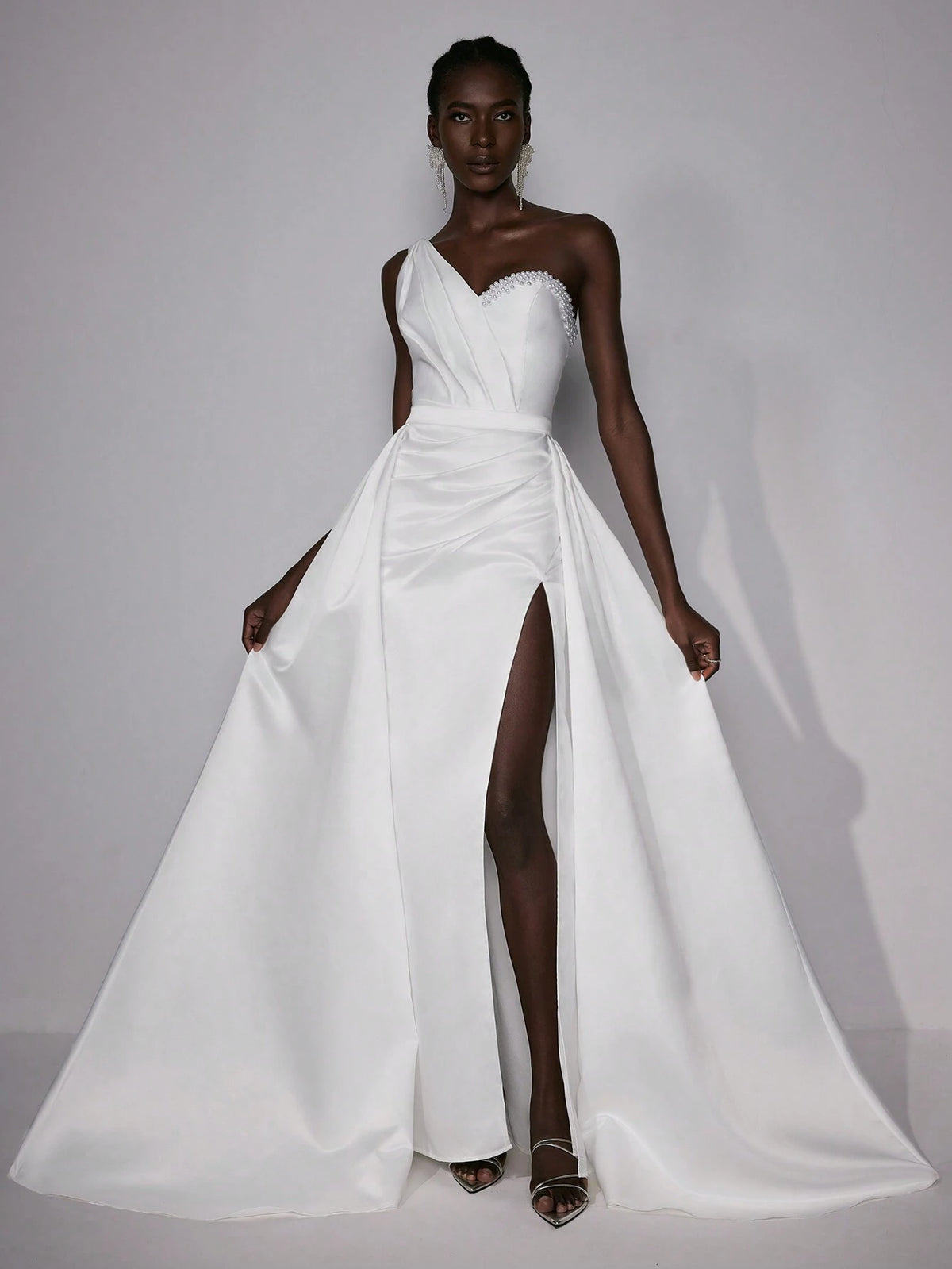 Elitara Elegant & Luxurious Satin One Shoulder Pearl & Rhinestone Decorated Asymmetrical Hemline High Split Mermaid Wedding Dress With Detachable Oversized Ruffled Skirt Panels