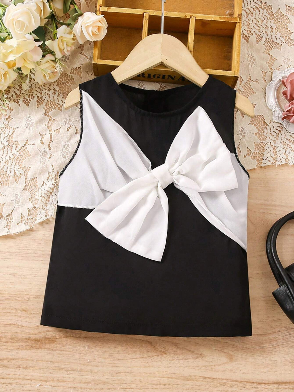 Girl Top With Black And White Color Block Design And Elegant Bow