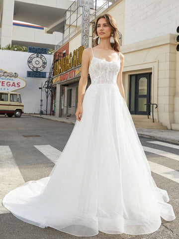 Lace Stitched Floor-Length Wedding Dress With Large Hemline And Spaghetti Straps