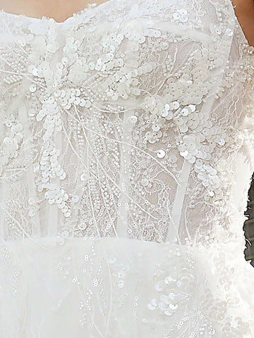 Lace Stitched Floor-Length Wedding Dress With Large Hemline And Spaghetti Straps