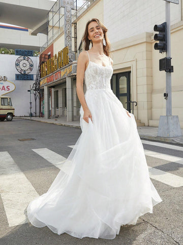 Lace Stitched Floor-Length Wedding Dress With Large Hemline And Spaghetti Straps