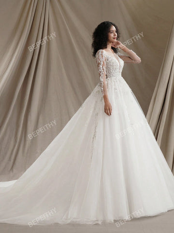New Arrival Princess Long Sleeves Shinny Wedding Dresses Sexy Deep V Neck Bride Ivory Glitter Bridal Gown With Beading Bodice