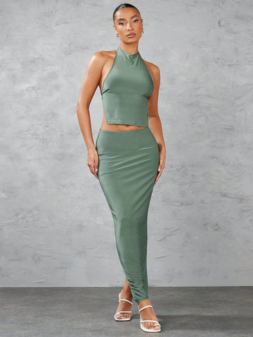 Green Solid Color Halter Backless Crop Top And Low Waist Slit Long Skirt Set For Going Out In Summer