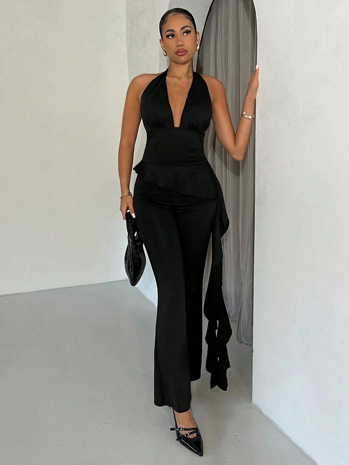 Ladies' Solid Black Halter Flare Jumpsuit With Ruffle Hem, Summer