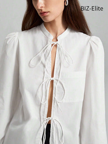 BIZwear Women's Solid Color Lantern Sleeve Lace-up Shirt