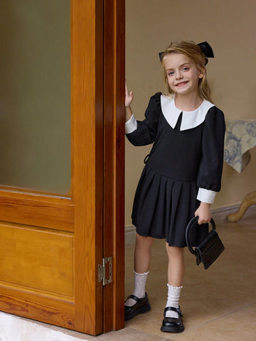 Classic Black & White Commuter Casual Dress For Young Girl, Featuring Fashionable Retro Design With Oversized White Collar, Black Long Sleeves, And Pleated Skirt.
