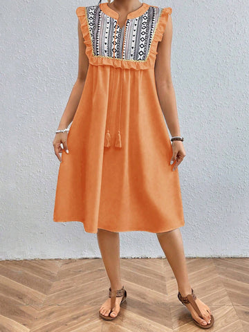 Geometric Printed Sleeveless Dress With Ruffle Hem And Embellished Trim