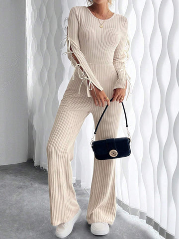Retro Cut-Out Round Neck Long Sleeve Knitted Jumpsuit With Bow Tie Detail And Slim Fit Design