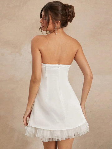 Elegant White Strapless Dress With Black Bow And Tulle Hem