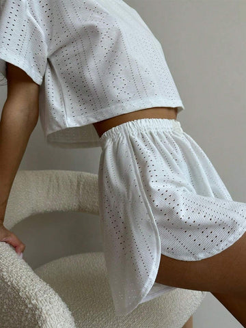Ladies' Simple Hollow Out Solid Color Short Sleeve Top And Shorts Set