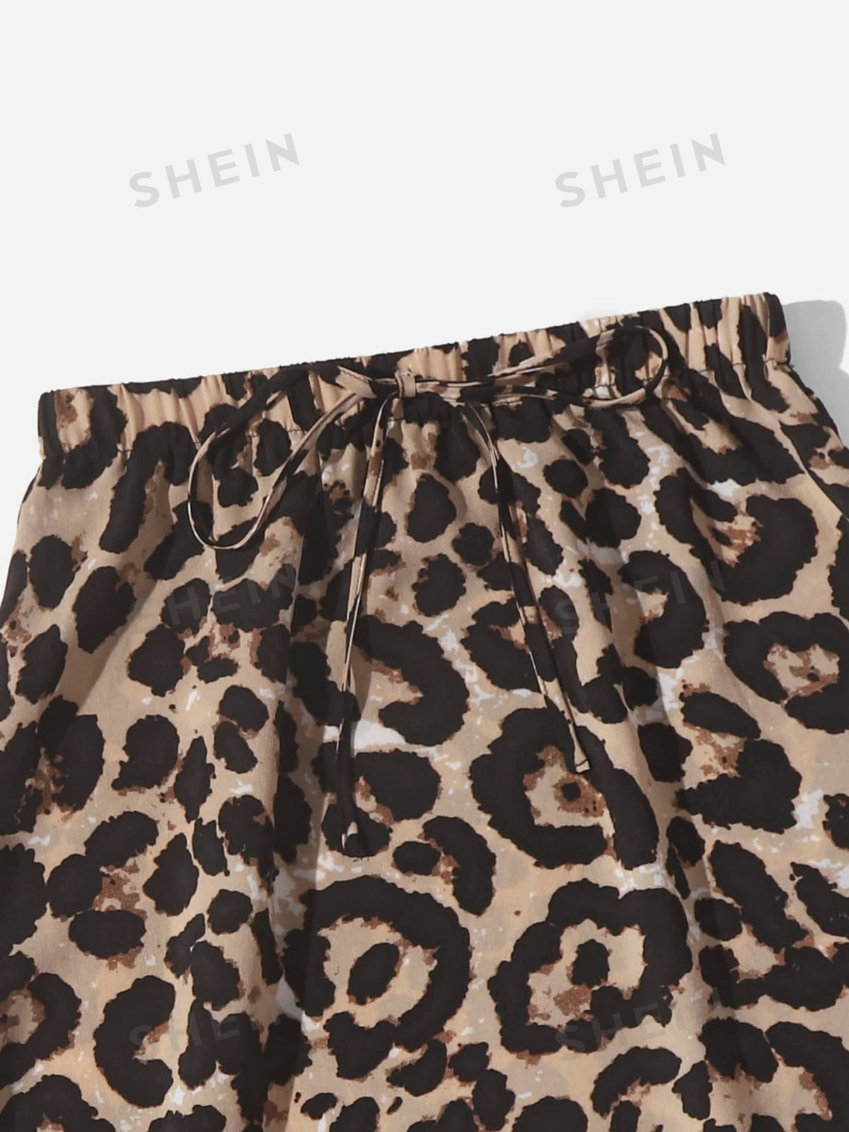 LUNE Leopard Print Curved Hem Skirt