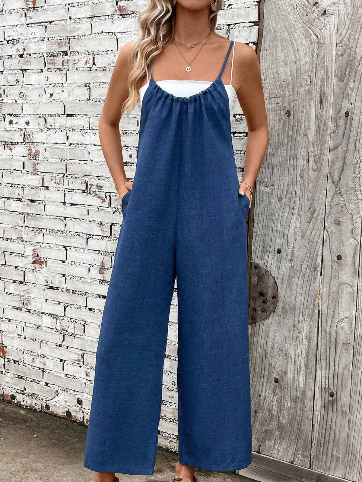 Solid Color Spaghetti Strap Jumpsuit With Slanted Pockets For Vacations And Leisure
