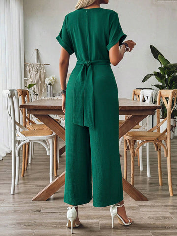 Spring And Summer Elegant Vacation Jumpsuit With Crossed Collar, Gathered Waist And Wide Leg Cut In Textured Fabric
