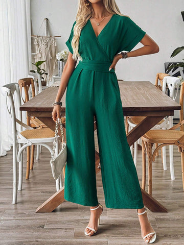 Spring And Summer Elegant Vacation Jumpsuit With Crossed Collar, Gathered Waist And Wide Leg Cut In Textured Fabric