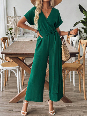 Spring And Summer Elegant Vacation Jumpsuit With Crossed Collar, Gathered Waist And Wide Leg Cut In Textured Fabric