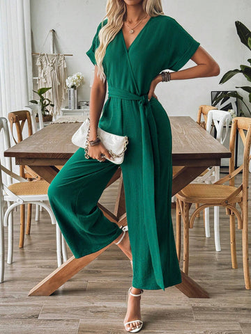 Spring And Summer Elegant Vacation Jumpsuit With Crossed Collar, Gathered Waist And Wide Leg Cut In Textured Fabric