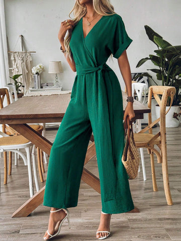 Spring And Summer Elegant Vacation Jumpsuit With Crossed Collar, Gathered Waist And Wide Leg Cut In Textured Fabric