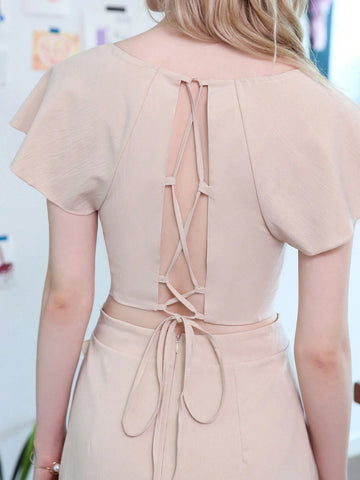 Elegant Women's Summer Two Piece Set Featuring Cap Sleeve Cut-Out Top With Criss-Cross Straps And Ruffled Hem With Floral Midi Skirt