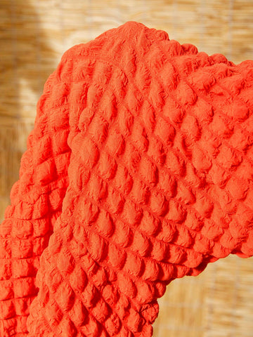 Ladies' Orange Bubble Grid Three-Piece Set For Beach Vacation With One-Shoulder Twisted Short Top, One-Piece Skirt With Briefs