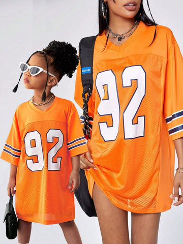 Mommy And Me Matching Outfits For Young Girls - Knitted Cool Street Style Sporty Numeric American Academy Oversized Hip-Hop V-Neck T-Shirt And Orange Jersey Summer, Fall, Sports, Streetwear, Mother-Daughter Outfits, And Athletic Events.