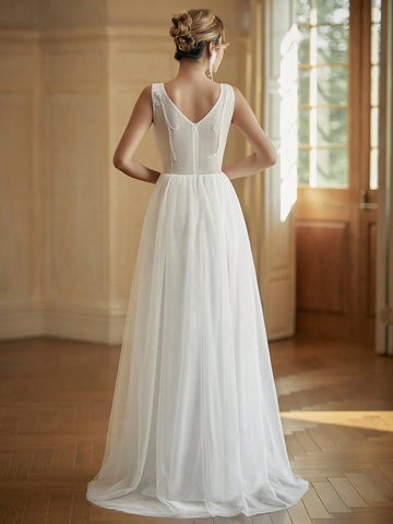 V-Neck Embroidered Tulle Wedding Dress With Sparkly Sequin Details In Contrasting Colors