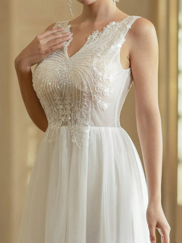 V-Neck Embroidered Tulle Wedding Dress With Sparkly Sequin Details In Contrasting Colors