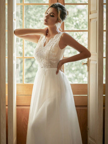 V-Neck Embroidered Tulle Wedding Dress With Sparkly Sequin Details In Contrasting Colors