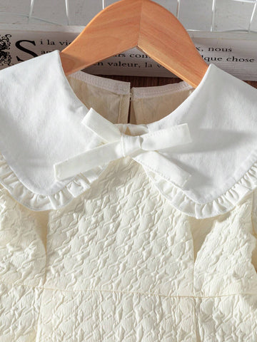 Young Girl' Color Block Dress With Peter Pan Collar, Ruffle Trim Cuffs, Bow Accent, Showing A Sweet And Adorable Style.