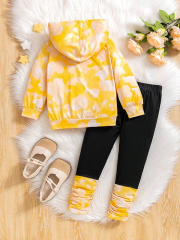 Young Girl' Cute Yellow Hooded Knit Sweater With Cartoon Print, Contrasted With Black Leggings. Comfortable And Fashionable For Everyday Wear. Suitable For Autumn/Winter