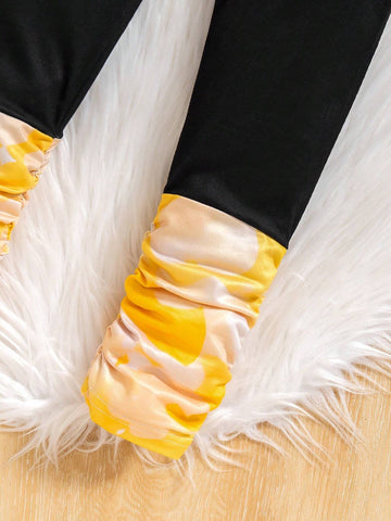 Young Girl' Cute Yellow Hooded Knit Sweater With Cartoon Print, Contrasted With Black Leggings. Comfortable And Fashionable For Everyday Wear. Suitable For Autumn/Winter