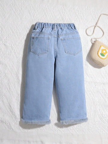 Young Girl Washed Denim Jeans With Holiday Casual Style And Faux Fur Hem