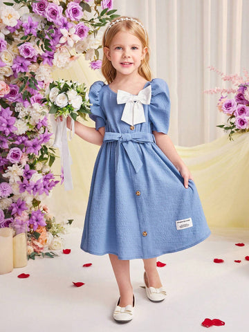 Young Girl Woven Short Sleeve Dress With Bow Knot Decoration And A Waistband For Spring Or Summer