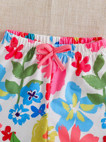 Young Girl's Short Sleeve Top With Letter Print & Ruffle Trim And Floral Printed Shorts